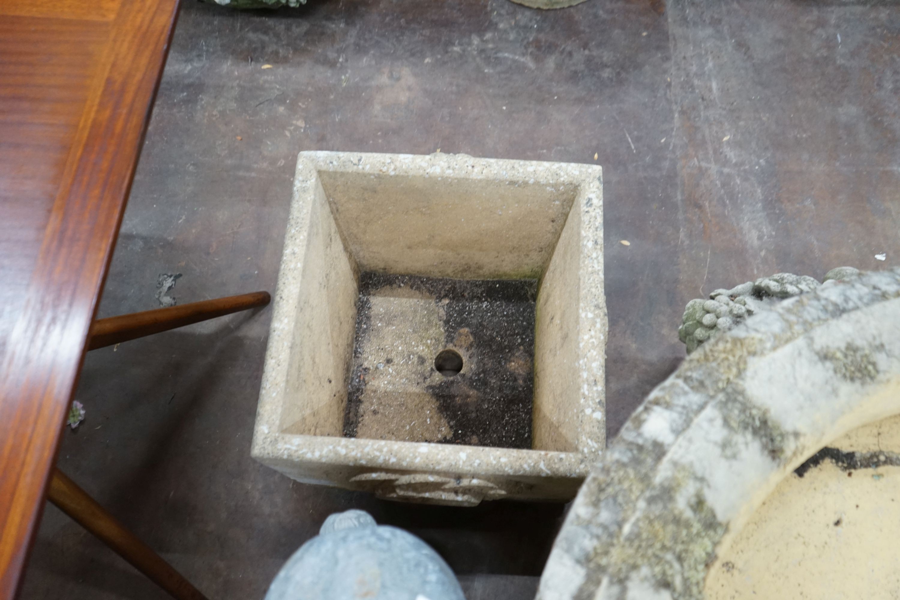 A pair of square reconstituted stone Fleurs de Lys garden planters, width 45cm, height 42cm